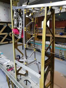 In the main workshop, Murphy has been continuing his fabrication on nose rib 10 for the port wing. Once finished he will then be starting fabrication of the same rib for the starboard wing. While now in the wing-shed, focus has now shifted back towards the root of the wing and in particular the wheel well area. While awaiting some more information to help correctly fabricate centre rib 8, I have focused my attention into fabricating the auxiliary spar that joins rib 5 and 8 together aft of the main undercarriage bay. While it may appear relatively simple at first on the 2D drawing, you soon realise that not only is it mounted on an angle within the wing, it has various folds at differing angles, and comprised of 4 individual components. The angles for example are shaped in 3 different planes, causing the material to be bent into ways that it doesn’t want to go. Using everyone’s knowledge from across the team and Laurent in particular has ensured that we have now been able to fabricate the bulk of the whole item, with only the simpler components remaining before moving onto the next stage. All Images © Parnall Aircraft Company Ltd