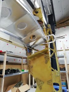 In the main workshop, Murphy has been continuing his fabrication on nose rib 10 for the port wing. Once finished he will then be starting fabrication of the same rib for the starboard wing.  While now in the wing-shed, focus has now shifted back towards the root of the wing and in particular the wheel well area. While awaiting some more information to help correctly fabricate centre rib 8, I have focused my attention into fabricating the auxiliary spar that joins rib 5 and 8 together aft of the main undercarriage bay.  While it may appear relatively simple at first on the 2D drawing, you soon realise that not only is it mounted on an angle within the wing, it has various folds at differing angles, and comprised of 4 individual components.  The angles for example are shaped in 3 different planes, causing the material to be bent into ways that it doesn’t want to go. Using everyone’s knowledge from across the team and Laurent in particular has ensured that we have now been able to fabricate the bulk of the whole item, with only the simpler components remaining before moving onto the next stage.  All Images © Parnall Aircraft Company Ltd